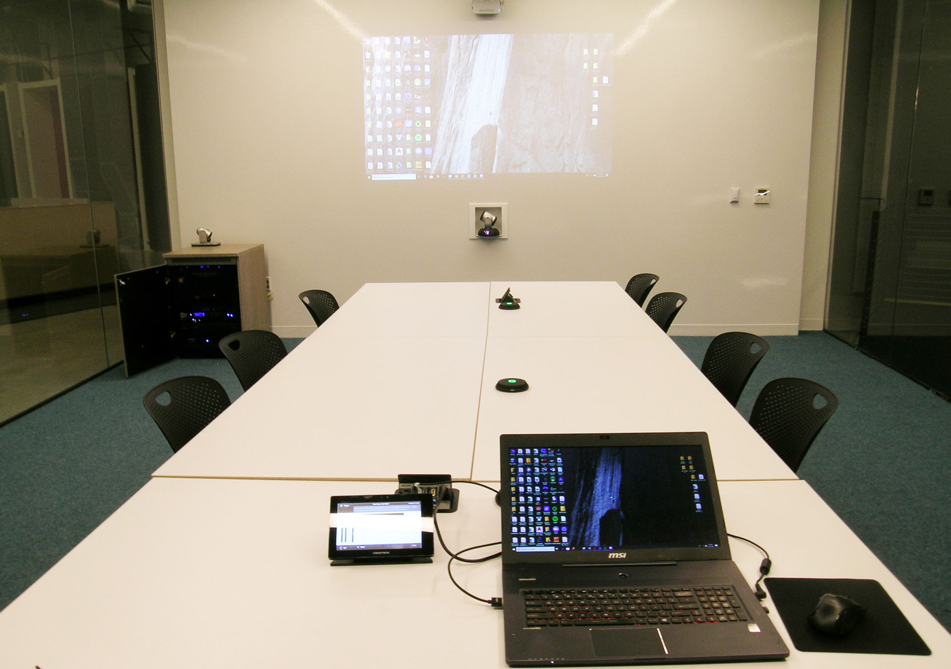 MGA fish bowl conference room wall projector