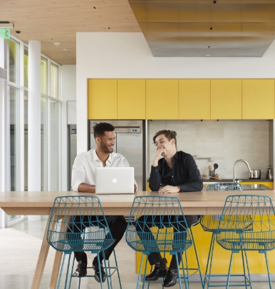 Two people planning over a laptop.